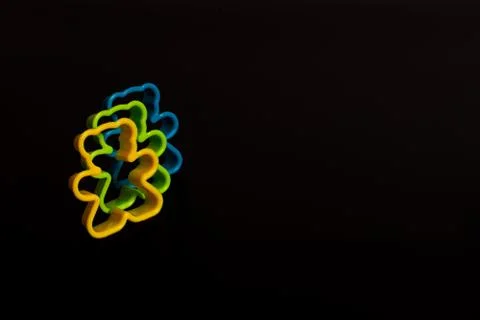 Three multi-colored plastic cookie cutter for making cookies in the form of a Stock Photos