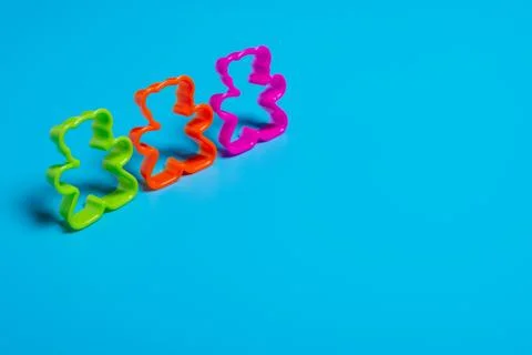 Three multi-colored plastic cookie cutter for making cookies in the shape of  写真素材
