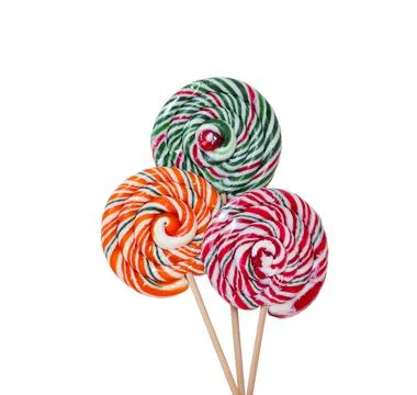 Three multi-colored round lollipops on wooden sticks on a white background Stock Photos