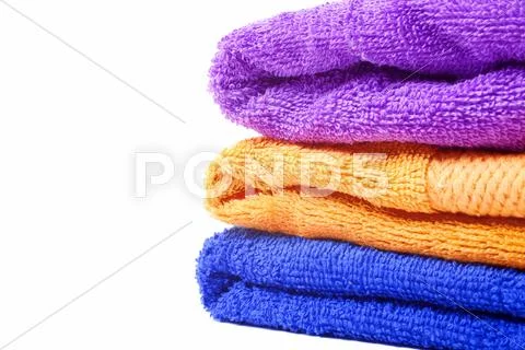 Three multi-colored towels Stock Photos