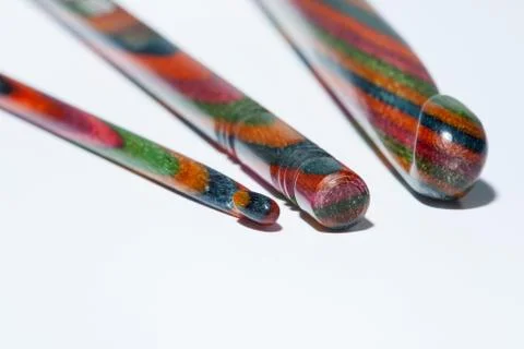 Three multi-coloured crochet hooks Stock Photos