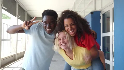 Three multi-ethnic young people laughing and looking at camera having fun Stock Footage 202165033