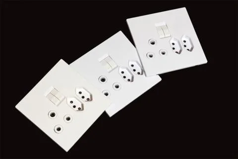 Three  Multipurpose Wall Mount Electric Sockets and Switches Stock Photos