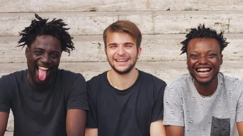 Three multiracial young man friends laughing together Stock-Footage 218609902