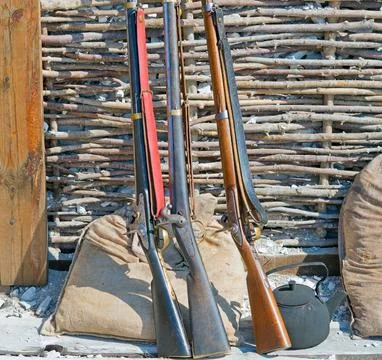 Three muzzle loading firearm Stock Photos