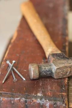Three Nails and Hammer Stock Photos