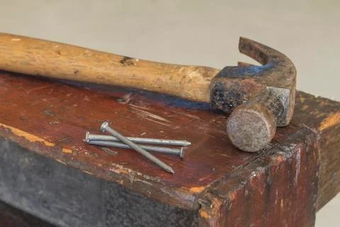Three Nails and Hammer Stock Photos