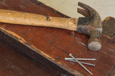 Three Nails and Hammer Stock Photos