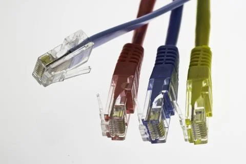 Three network cables and a flat cable configuration Stock Photos