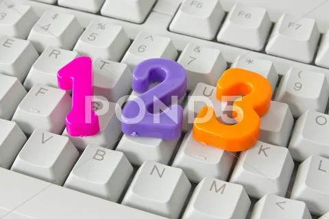 Three numbers on the computer keyboard Stock Photos