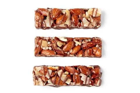 Three nut caramel bars isolated on white background. top view with copy space Stock Photos