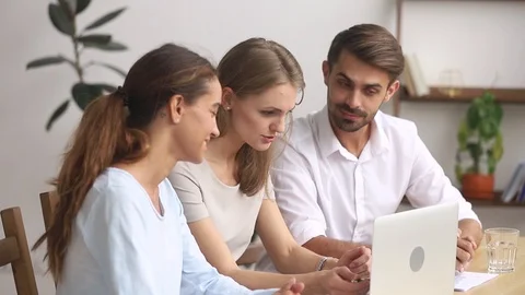 Three office workers planning work together using laptop online program Stock Footage 113293962