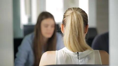 Three office workers sit at table and discuss working project Stock Footage 65311017