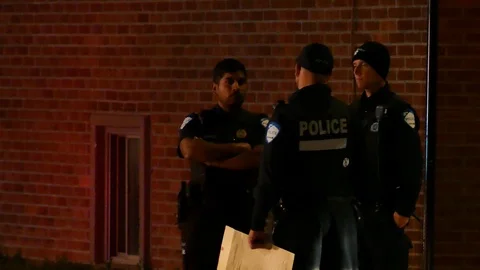 Three officers chatting with red lights Stock Footage 116708530