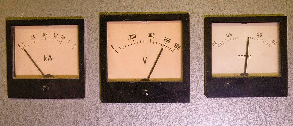 Three old analog instruments - Power factor meter, voltmeter and ampere meter Stock-Fotos