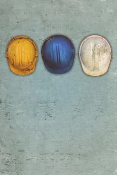 Three old and worn construction helmets Stock Photos