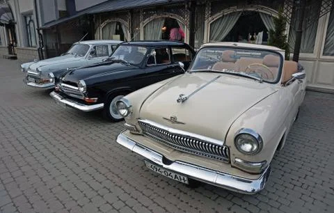 Three old classic soviet retro cars GAZ M21 Volga (grey, black, beige) produc Stock Photos