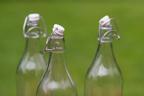 Three old-fashioned authentic milk bottles. Stock Photos