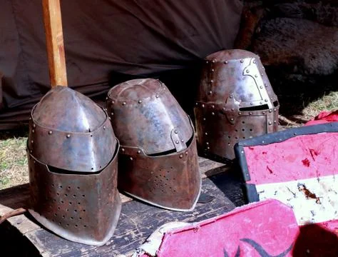 Three old knight helmets from the Middle Ages on the ark Stock Photos