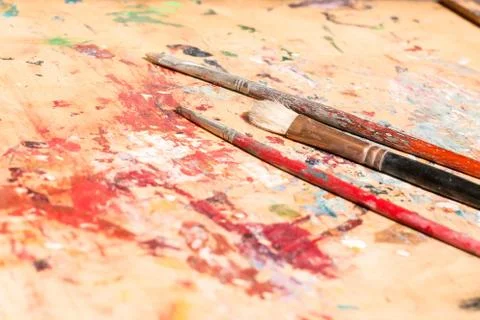 Three old paintbrushes Stock Photos