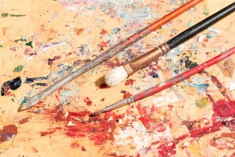 Three old paintbrushes Stock Photos