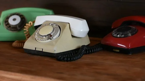 Three old phones on the table Stock Footage 114351576