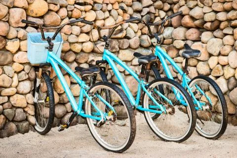 Three old, rusty blue bicycles Stock Photos