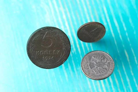 Three old Soviet coins falling on the table Stock Photos
