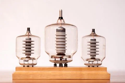 Three old vacuum transmitting tubes white background Stock Photos