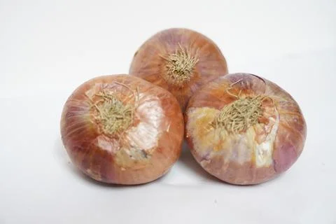 Three onion at white background Stock Photos