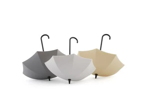 Three open umbrellas on white background with clipping path Stock Photos