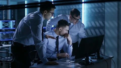 Three Operation Controllers Solving Problem in System Control Room.  Stock Footage 75004242