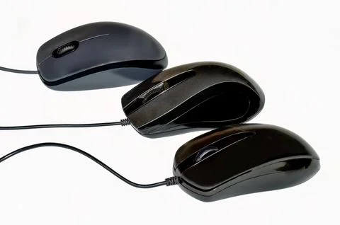 Three optical computer mouse devices in a row isolated on white background Stock Photos