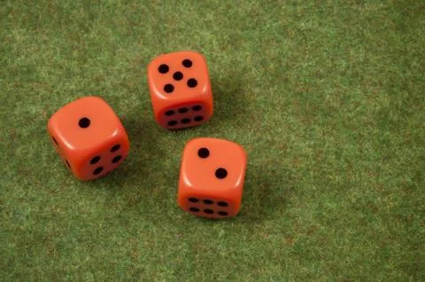 Three orange dice Stock Photos