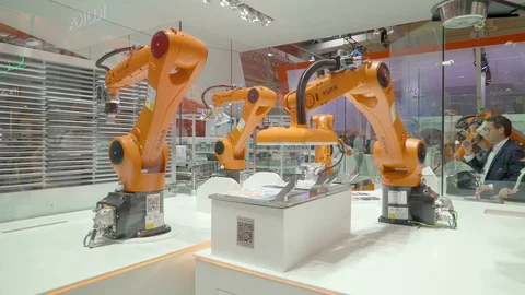 Three orange robotic machine functioning 動画素材 76175978