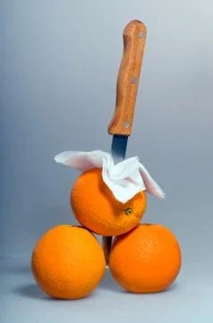 Three oranges lying on the background Stock Photos