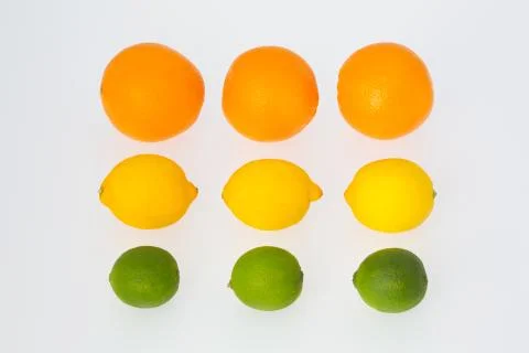 Three oranges, three lemons and three lime fruits Stock Photos
