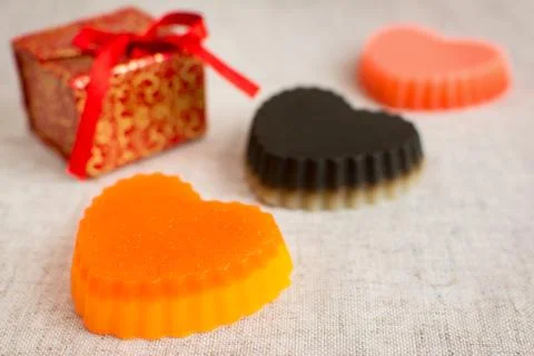 Three original handmade soaps shaped like hearts. Stock Photos