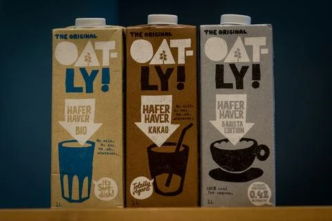Three packs of Oatly plant-based and vegan milk alternative Stock Photos