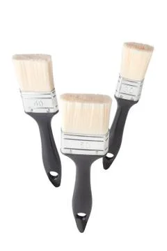 Three paintbrushes on white Stock Photos