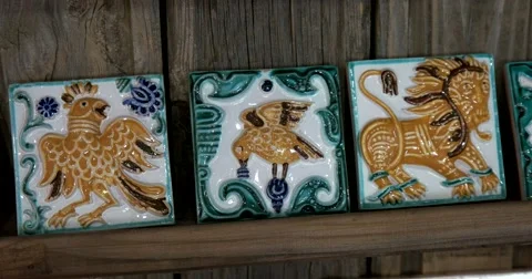 Three painted ceramic tile, mythological creatures, shop Suzdal Stock Footage 66292887