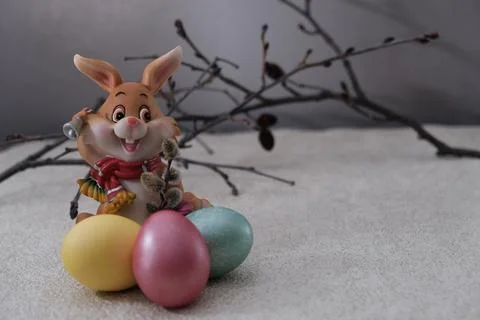 Three painted Easter eggs and twigs made of natural wood. Stock Photos