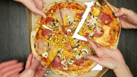 Three pairs of hands take pieces of sliced pizza out of the box Stock-Footage 195953500