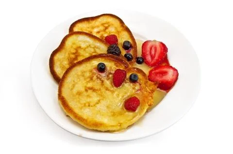 Three pancakes with berries Stock Photos