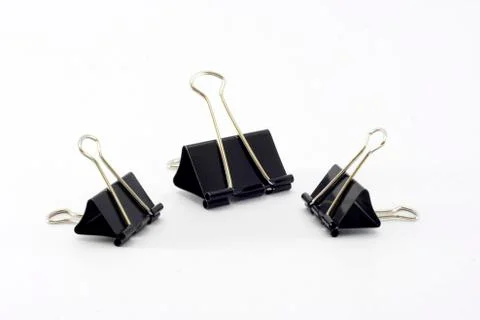 Three paper clips on white background. Stock Photos