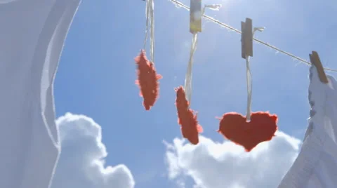 Three Paper Hearts on a Clothesline Stock-Footage 62383716