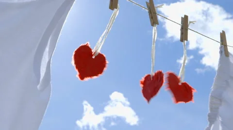 Three Paper Hearts on a Clothesline Vídeos de archivo 62384146