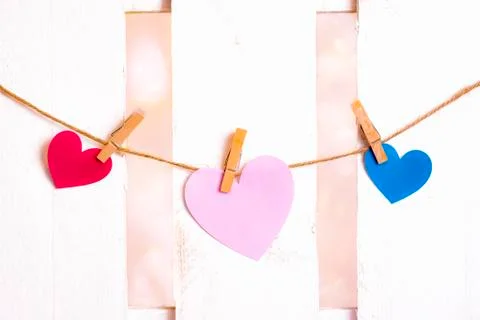 Three paper hearts on a string Stock Photos