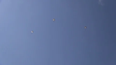 Three parachutists in descent Video stock 92464077