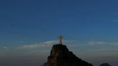 Three Paragliders Flying Around Christ the Redeemer in Rio Stock Footage 341360632